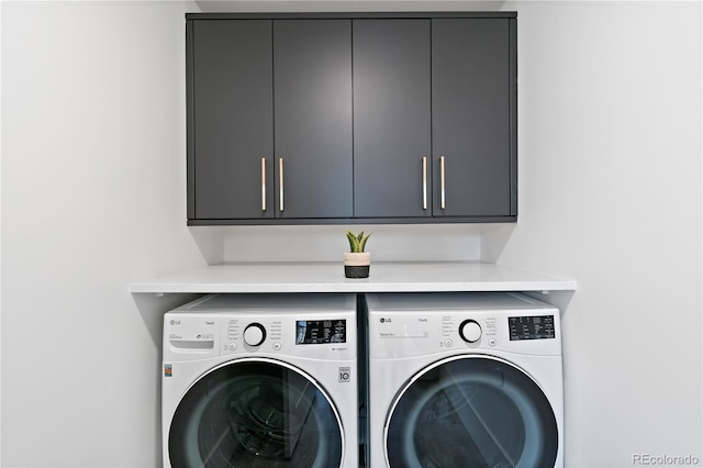 laundry area featuring cabinets and independent washer and dryer