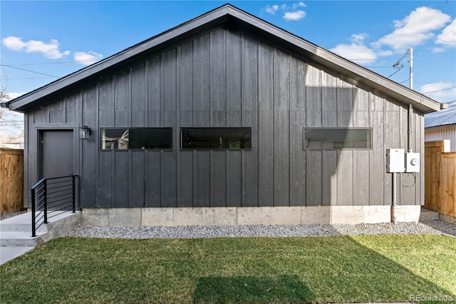 view of property exterior featuring a lawn