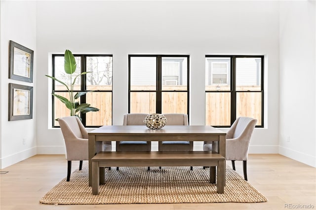 dining area with light wood-type flooring