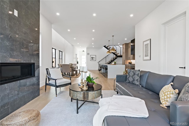 living room featuring a fireplace and light hardwood / wood-style floors