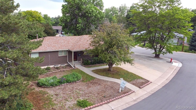 7140 S Uinta St, Centennial, CO 80112 - single story home with brick siding and concrete driveway