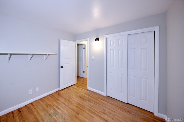7140 S Uinta St, Centennial, CO 80112 - unfurnished bedroom featuring baseboards, light wood-type flooring, and a closet