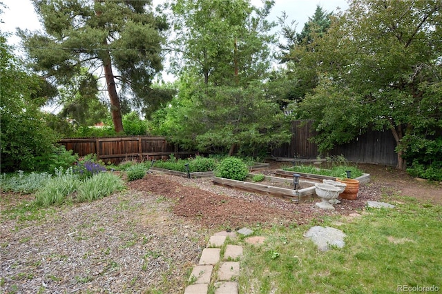 7140 S Uinta St, Centennial, CO 80112 - fenced backyard with a vegetable garden