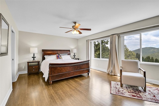 33633 Elk Run, Evergreen, CO 80439 - bedroom featuring wood finished floors and baseboards