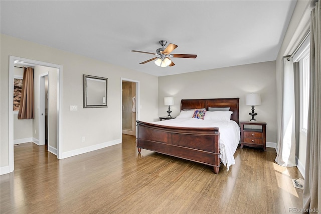 33633 Elk Run, Evergreen, CO 80439 - bedroom featuring wood finished floors, baseboards, and a ceiling fan