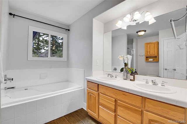 33633 Elk Run, Evergreen, CO 80439 - full bathroom featuring double vanity, a bath, wood finished floors, and a shower
