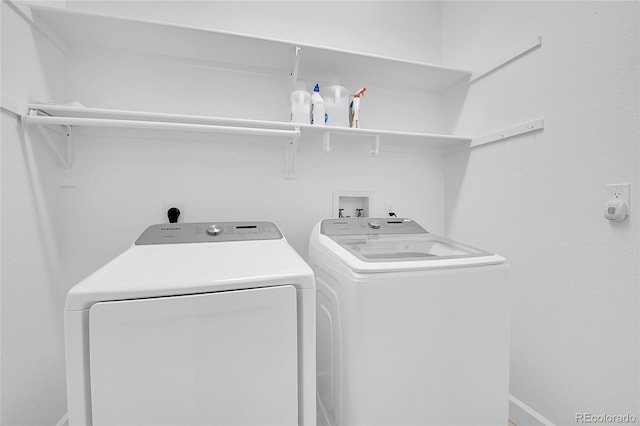 33633 Elk Run, Evergreen, CO 80439 - laundry room featuring washer and dryer and baseboards