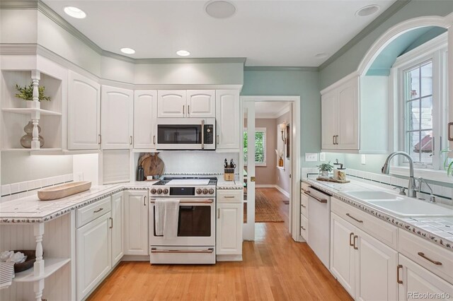 5530 E 6th Avenue Parkway, Denver, CO 80220 - kitchen featuring white appliances, open shelves, a sink, light wood finished floors, and white cabinets