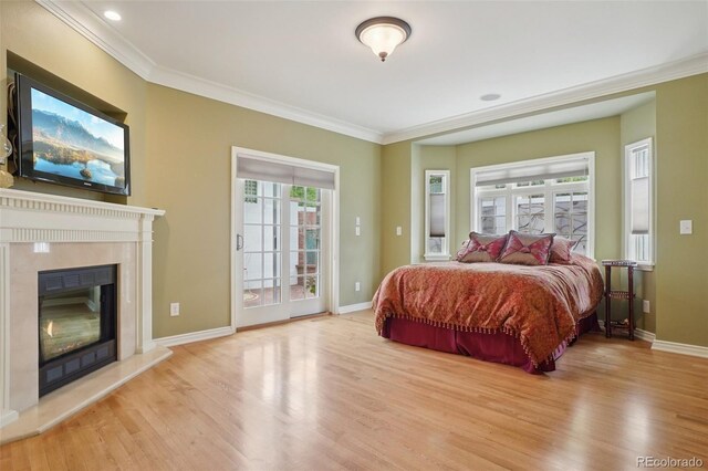 5530 E 6th Avenue Parkway, Denver, CO 80220 - bedroom featuring wood finished floors, ornamental molding, multiple windows, and access to exterior