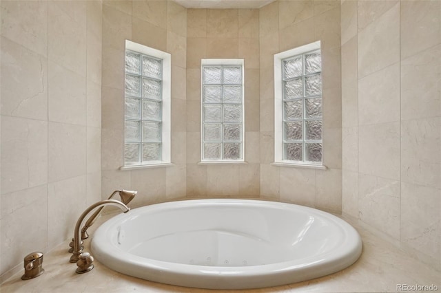 5530 E 6th Avenue Parkway, Denver, CO 80220 - full bathroom featuring tile walls, a jetted tub, and healthy amount of natural light