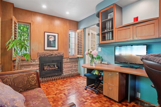 5530 E 6th Avenue Parkway, Denver, CO 80220 - office area featuring built in study area, a brick fireplace, recessed lighting, and wood walls