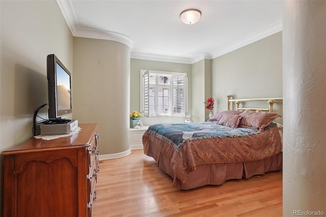 5530 E 6th Avenue Parkway, Denver, CO 80220 - bedroom featuring light wood-style floors, ornamental molding, and baseboards