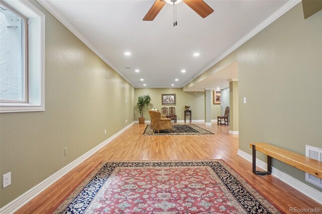 5530 E 6th Avenue Parkway, Denver, CO 80220 - living area featuring wood finished floors, ornamental molding, a ceiling fan, baseboards, and recessed lighting