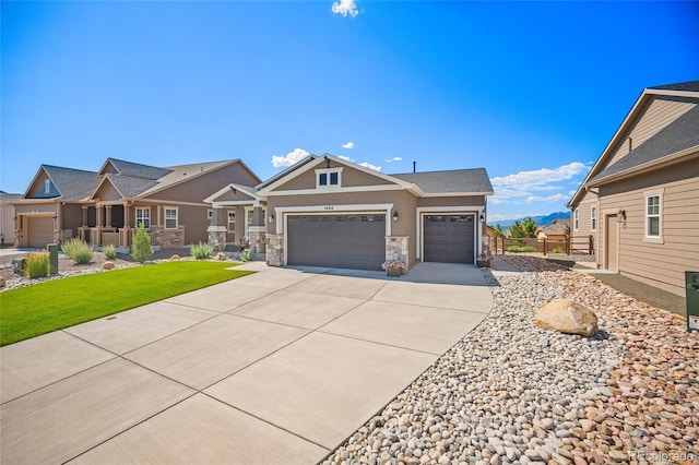 1485 Captiva Beach Ln, Monument, CO 80132 - craftsman-style house with an attached garage, driveway, stucco siding, stone siding, and a front yard