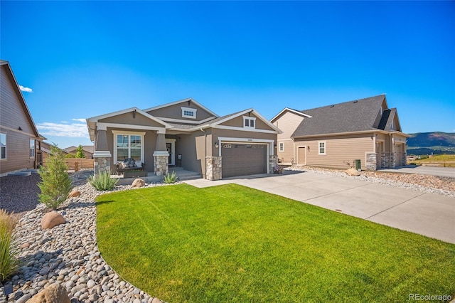 1485 Captiva Beach Ln, Monument, CO 80132 - craftsman-style home with stone siding, stucco siding, a porch, and driveway