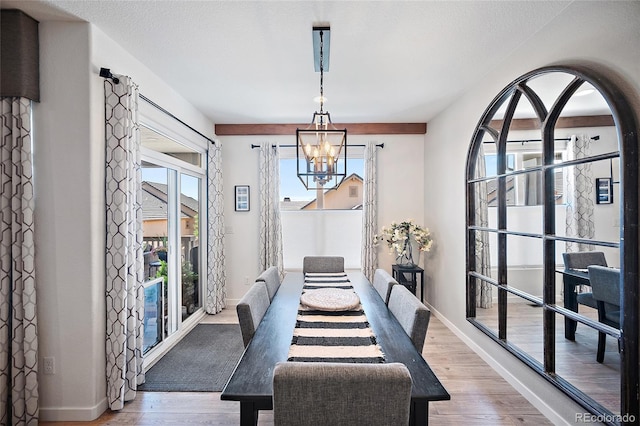 1485 Captiva Beach Ln, Monument, CO 80132 - dining area featuring a chandelier and wood finished floors