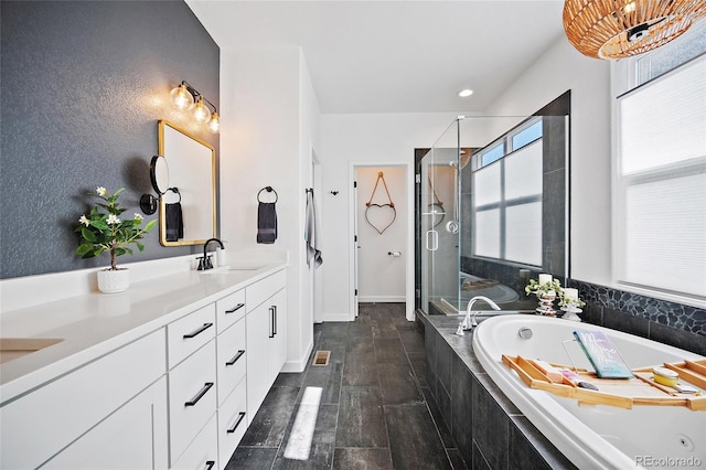 1485 Captiva Beach Ln, Monument, CO 80132 - bathroom featuring a tub with jets, double vanity, and a shower stall