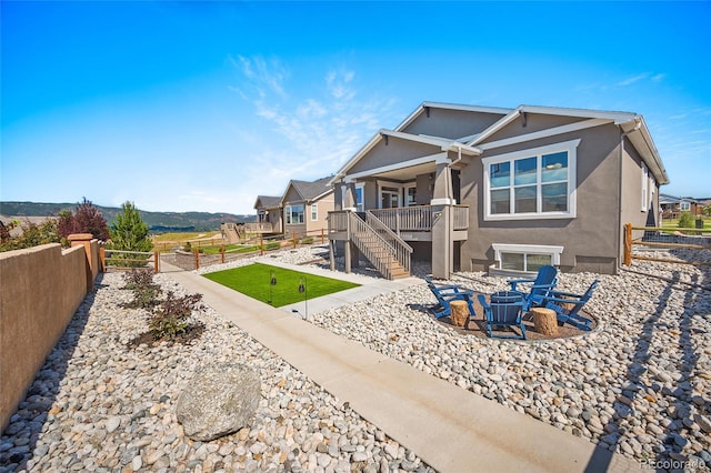 1485 Captiva Beach Ln, Monument, CO 80132 - rear view of property with a fenced backyard, stucco siding, stairway, and a patio