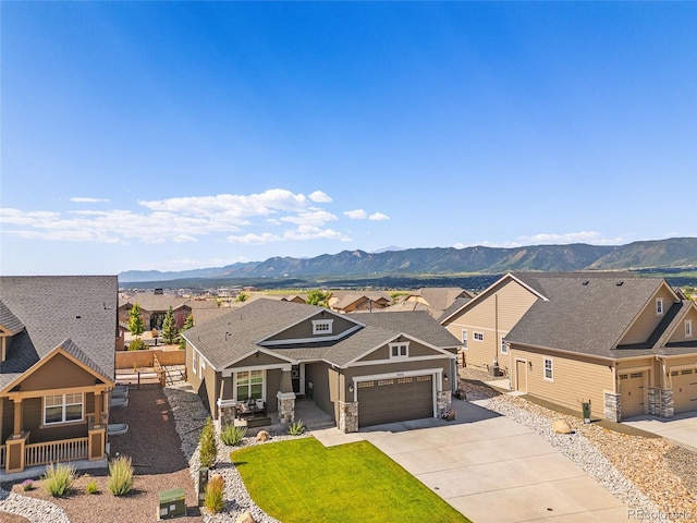 1485 Captiva Beach Ln, Monument, CO 80132 - craftsman house with stone siding, a mountain view, concrete driveway, and a residential view