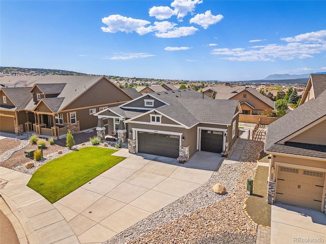 1485 Captiva Beach Ln, Monument, CO 80132 - craftsman-style home featuring stone siding, a residential view, stucco siding, driveway, and a shingled roof