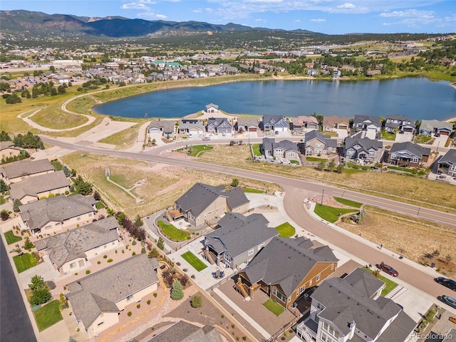 1485 Captiva Beach Ln, Monument, CO 80132 - aerial overview of property's location featuring nearby suburban area and a water and mountain view