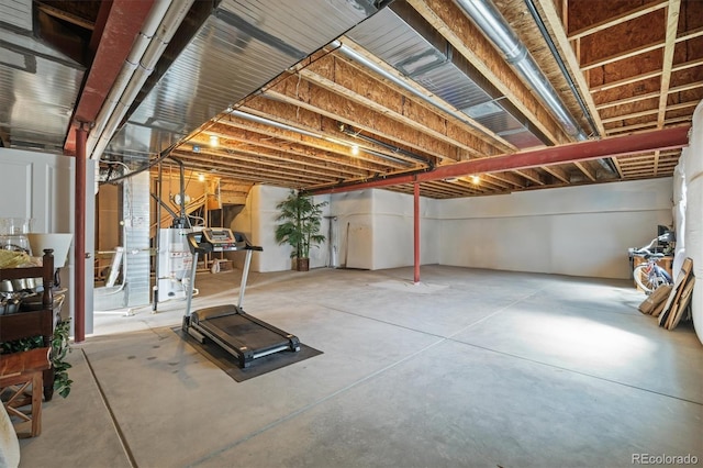 unfinished basement with water heater