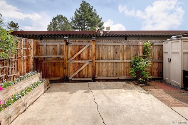view of outdoor structure with a gate and fence
