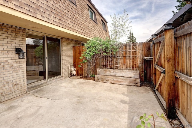 view of patio featuring fence