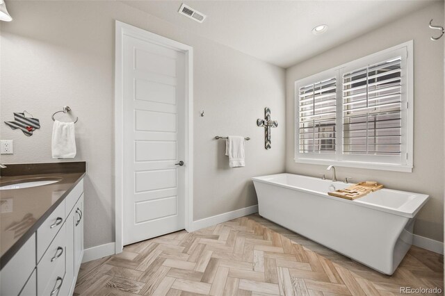 10401 Maplebrook Way, Highlands Ranch, CO 80126 - full bath with a freestanding bath, vanity, and recessed lighting