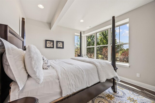 10401 Maplebrook Way, Highlands Ranch, CO 80126 - bedroom featuring multiple windows, recessed lighting, beam ceiling, and wood finished floors