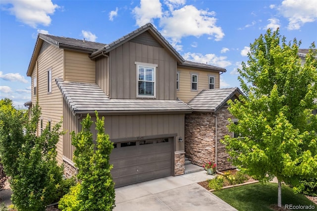 10401 Maplebrook Way, Highlands Ranch, CO 80126 - view of front facade featuring a garage, stone siding, driveway, and board and batten siding