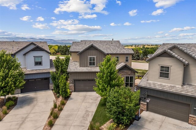 10401 Maplebrook Way, Highlands Ranch, CO 80126 - traditional-style house with a garage, board and batten siding, stone siding, concrete driveway, and a mountain view