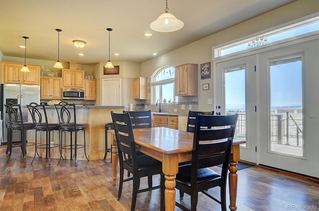 dining space featuring dark wood finished floors and recessed lighting