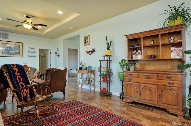 sitting room featuring ceiling fan, visible vents, recessed lighting, wood finished floors, and baseboards