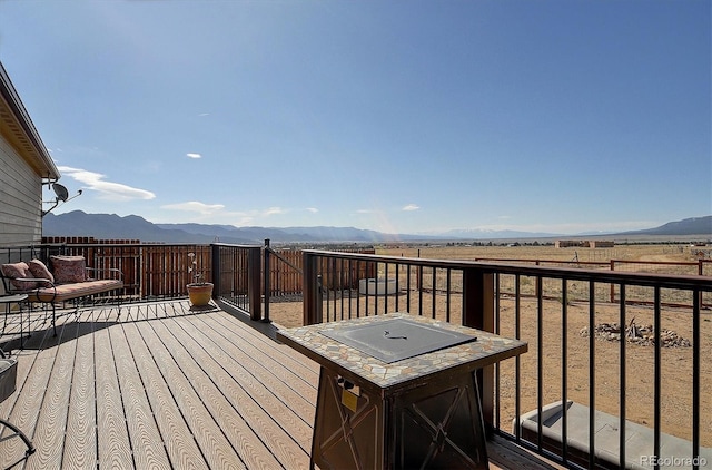wooden terrace with a mountain view
