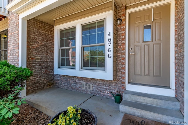 4676 S Dillon Ct Unit G, Aurora, CO 80015 - entrance to property featuring a porch and brick siding