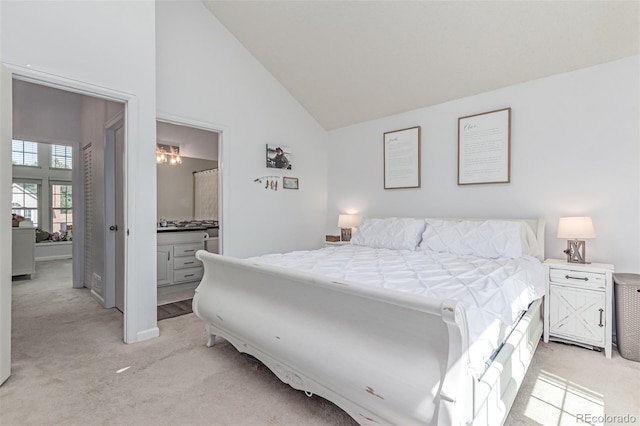 4676 S Dillon Ct Unit G, Aurora, CO 80015 - bedroom featuring light colored carpet, high vaulted ceiling, and connected bathroom