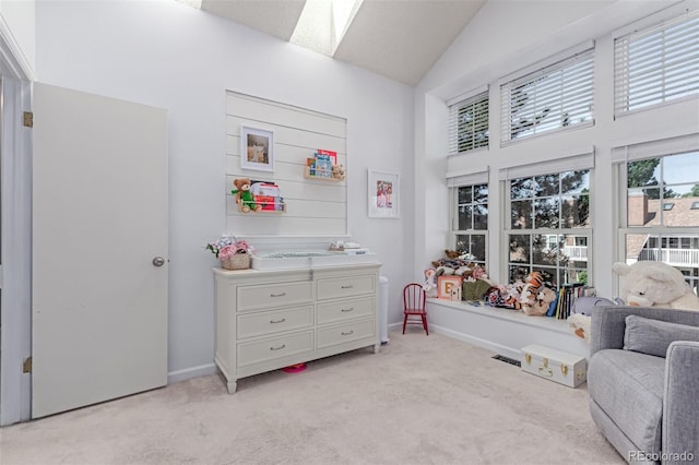 4676 S Dillon Ct Unit G, Aurora, CO 80015 - bedroom with light carpet, high vaulted ceiling, and a skylight