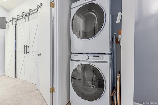 4676 S Dillon Ct Unit G, Aurora, CO 80015 - laundry room with stacked washer / dryer and carpet flooring