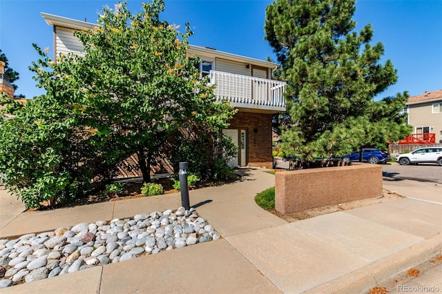 4676 S Dillon Ct Unit G, Aurora, CO 80015 - view of front of home with brick siding and a balcony