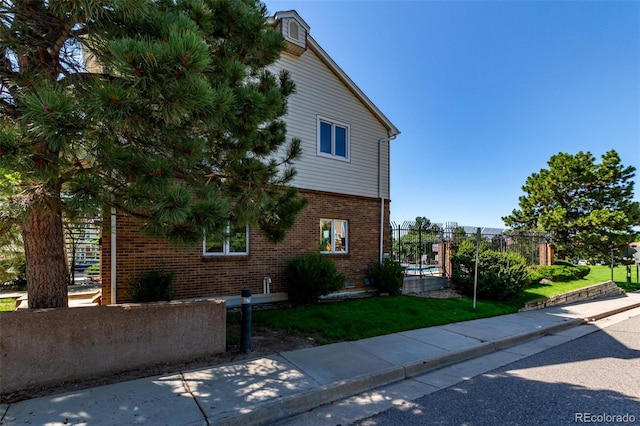 4676 S Dillon Ct Unit G, Aurora, CO 80015 - view of property exterior featuring brick siding