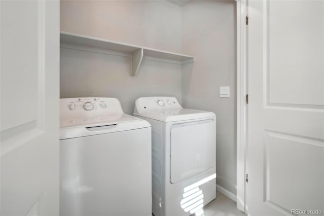 washroom featuring washer and dryer