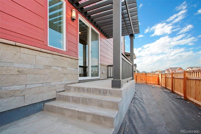 entrance to property with a patio area