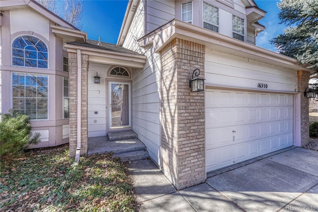 doorway to property featuring a garage