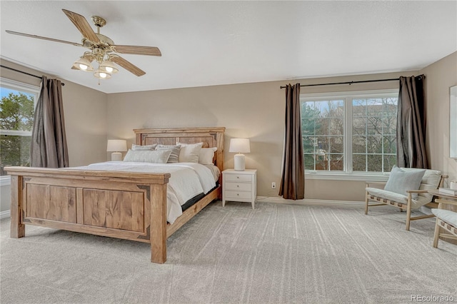 bedroom with light carpet and ceiling fan