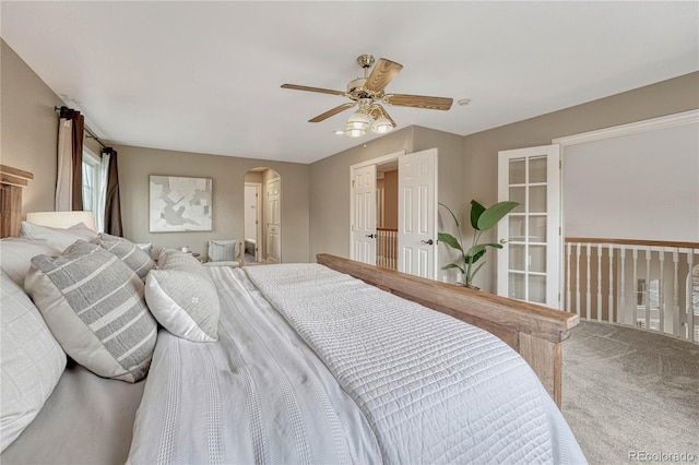 bedroom featuring ceiling fan and carpet