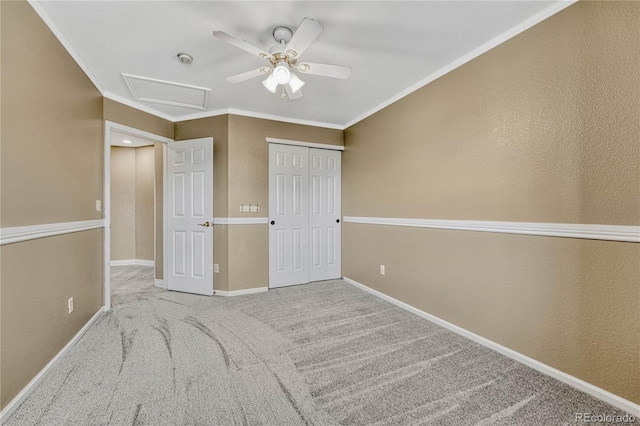 unfurnished bedroom featuring light carpet, ornamental molding, a closet, and ceiling fan