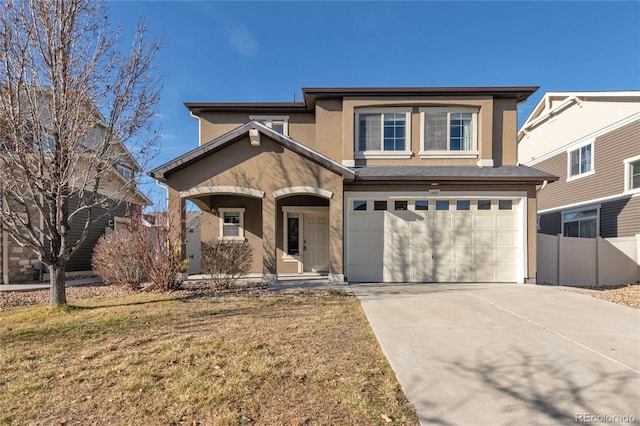 view of front of home featuring a front yard and a garage