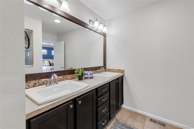 bathroom featuring tile patterned floors and vanity