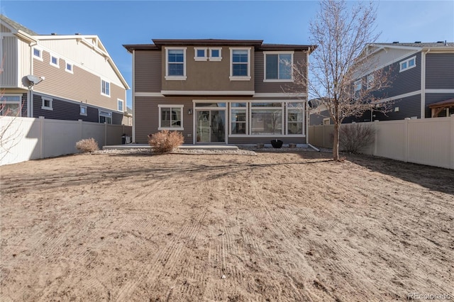 back of property with a patio